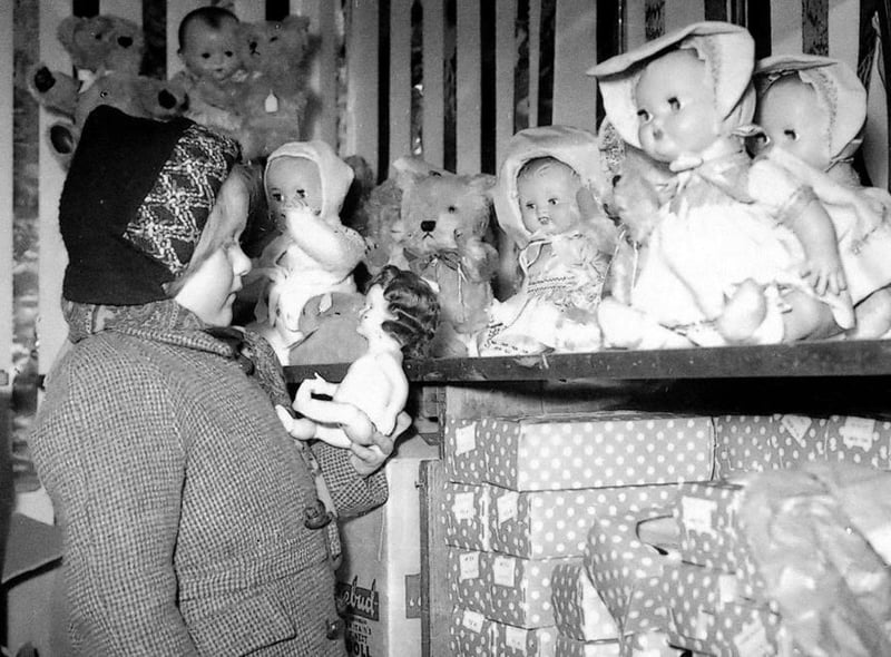 Choosing a doll at Joplings in 1953. Was it one of your favourite stores to visit? Photo: Bill Hawkins.