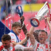 LONDON, ENGLAND - MAY 21: Corry Evans of Sunderland lifts the Sky Bet League One Play-Off trophy following victory in the Sky Bet League One Play-Off Final match between Sunderland and Wycombe Wanderers at Wembley Stadium on May 21, 2022 in London, England. (Photo by Justin Setterfield/Getty Images)