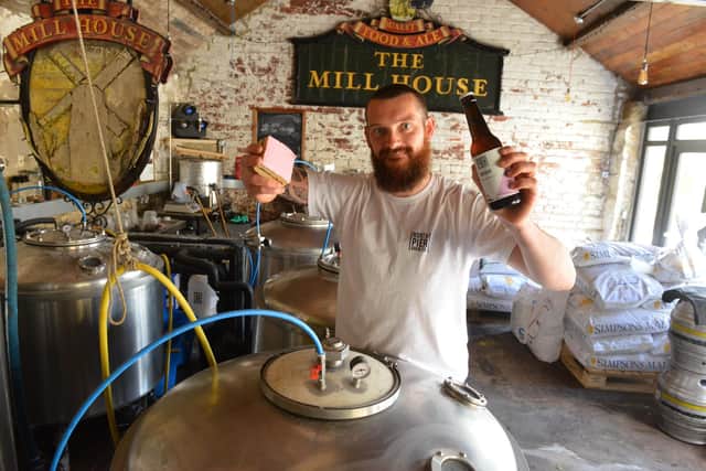 North Pier Brew co. owner and brewer Josh Atkinson with his pink slice flavour beer.