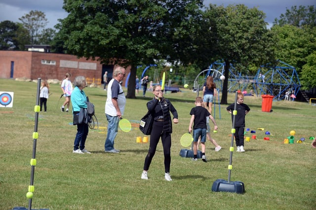 Children taking part in swing-ball as part of the family fun day.