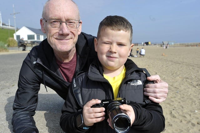 Cole Jackson, 59, with his grandson Jake Paxton, seven, getting some photographs of Roker Beach in the Spring sunshine. 

Picture by FRANK REID