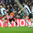 Fulham striker Aleksandar Mitrovic and Sunderland midfielder Dan Neil. Picture by FRANK REID