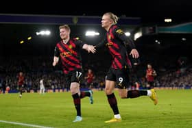 Manchester City's Erling Haaland (right) celebrates scoring their side's second goal of the game during the Premier League match at Elland Road, Leeds.