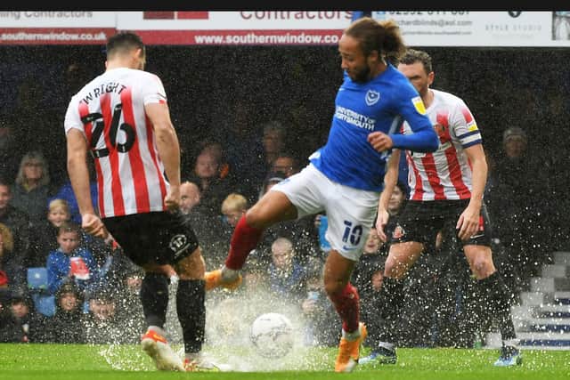 Portsmouth forward Marcus Harness and Sunderland defender Bailey Wright go for the ball.