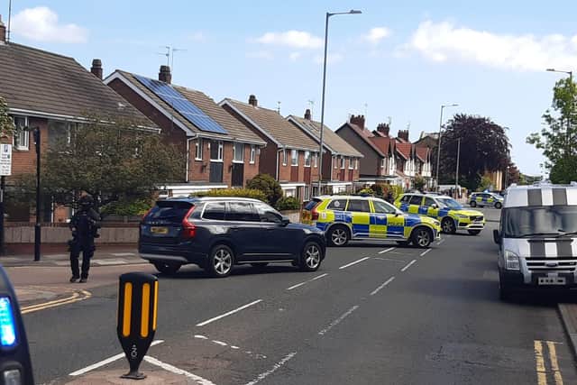 Armed police remain at the scene in Sunderland.