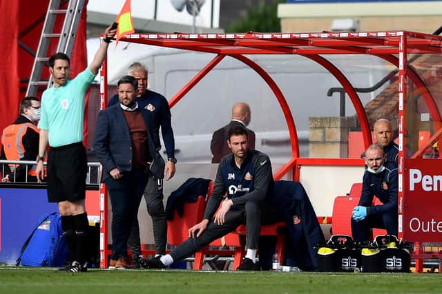Lee Johnson watches on at the LNER Stadium as Sunderland fall to a 2-0 defeat