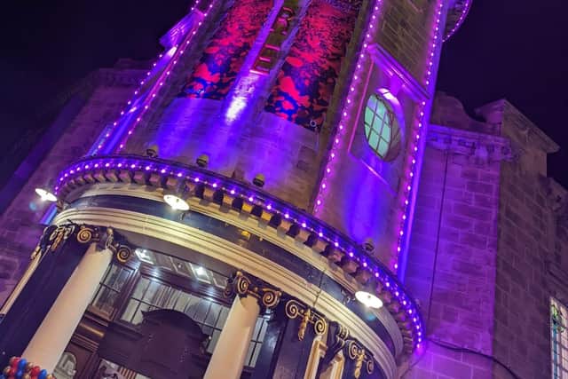 The Empire lit purple for Beauty and the Beast