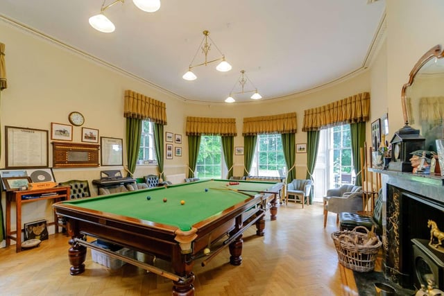 The double aspect games room is also set into a bay window and comes complete with a bar.
