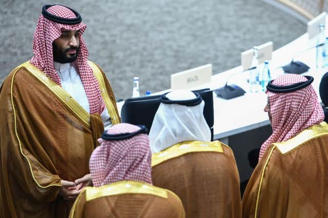 Saudi Arabia's Crown Prince Mohammed bin Salman (L) attends session 3 on women's workforce participation, future of work, and ageing societies during the G20 Summit in Osaka on June 29, 2019. (Photo by Brendan Smialowski / AFP)        (Photo credit should read BRENDAN SMIALOWSKI/AFP via Getty Images)