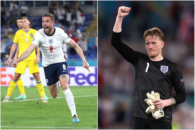 Jordan Henderson (left) celebrates his first ever England goal while Jordan Pickford salutes the fans