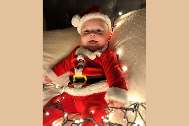 Emme, age 6 months, celebrating Christmas for the first time.
