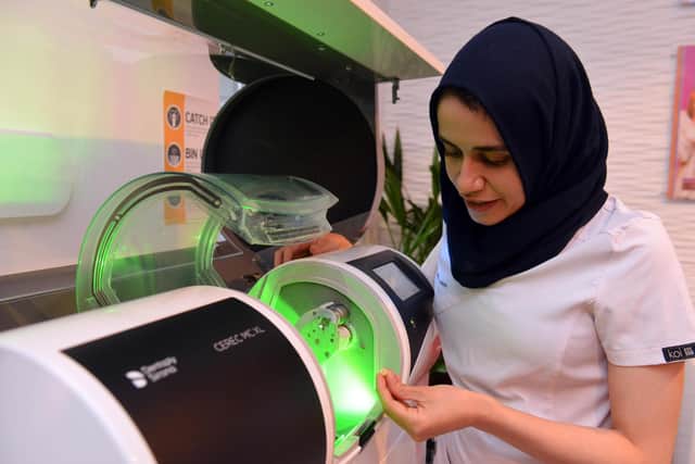 Salma Ainine using the hi-tech CEREC machine to create an implant