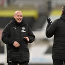 Newcastle United coaches Steve Agnew, Steve Harper and Stephen Clemence share a joke on the pitch in January.
