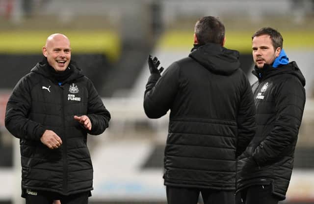 Newcastle United coaches Steve Agnew, Steve Harper and Stephen Clemence share a joke on the pitch in January.