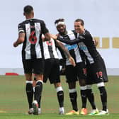 The Newcastle United players celebrate a goal in the 3-0 win over Sheffield United.
