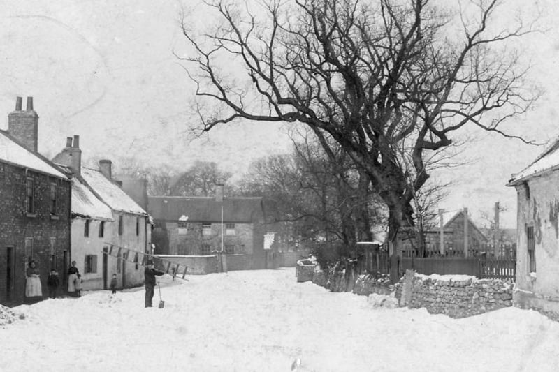 West Row Greatham in the snow showing a man carrying spade and ladder. When was the last time you saw snow like this in Greatham? Photo: Hartlepool Museum Service.