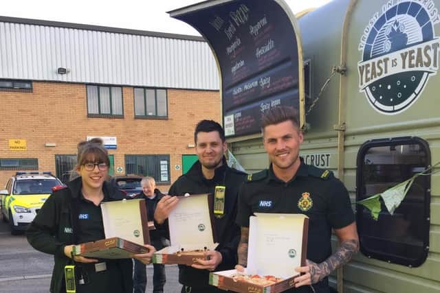 Hard-working North East Ambulance staff with free pizzas and messages of thanks from the community