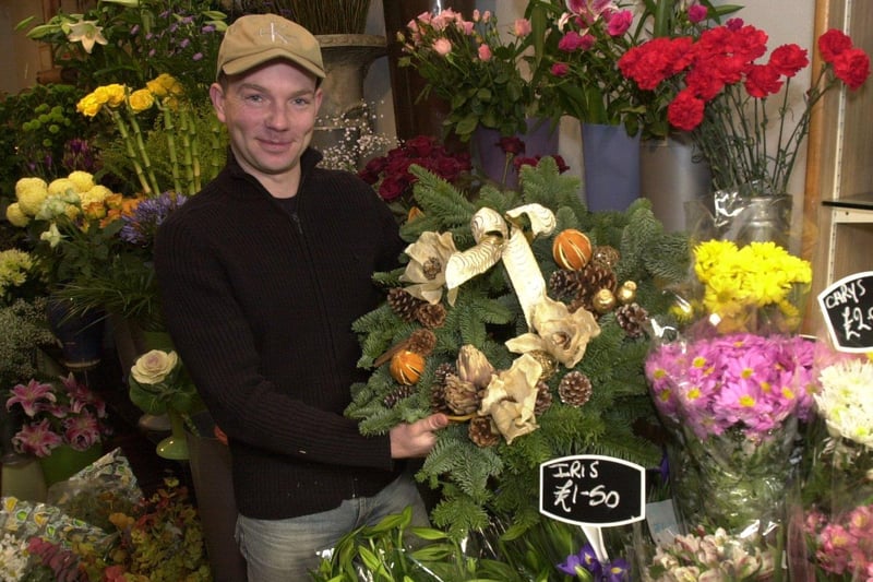 Shop owner Jonathan Moseley with a Christmas floral display at Anette Dyson's florists, Whitham Road, Broomhill, Sheffield in 2002