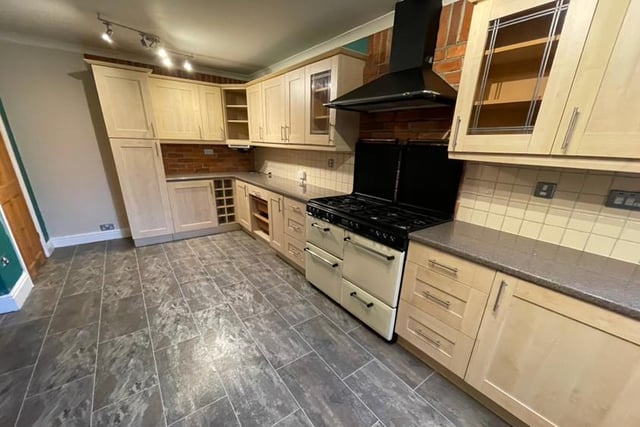 The attractive fitted kitchen has a bit of the wow factor about it, given its extensive range of wall and base units. There is space for a range-style cooker and chimney-style extractor hood, plus space and plumbing for an automatic washing machine. A large walk-in store cupboard and tiled flooring add to the room's appeal.