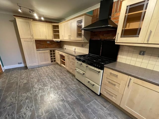 The attractive fitted kitchen has a bit of the wow factor about it, given its extensive range of wall and base units. There is space for a range-style cooker and chimney-style extractor hood, plus space and plumbing for an automatic washing machine. A large walk-in store cupboard and tiled flooring add to the room's appeal.