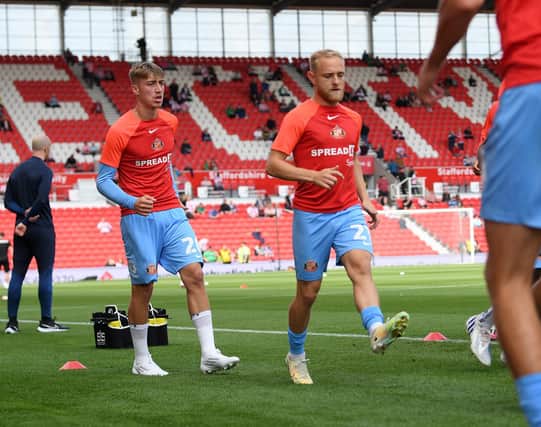 Jack Clarke (left) and Alex Pritchard warming up. Picture by FRANK REID