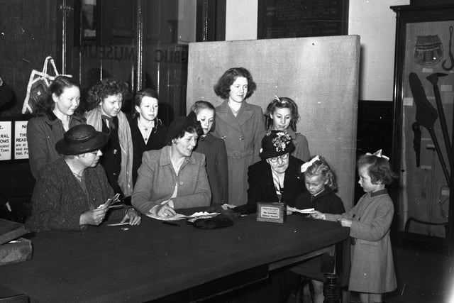 Despite the rain Sunderland school children presented themselves at the Central Library Buildings in 1947 hand over the donations from Sunderland schools to the Young People's Penny Brick League Committee.  The proceeds of the collection went to the Children's Hospital.