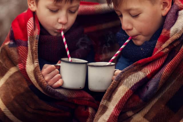 Families can enjoy hot chocolate while watching Christmas movie classics.