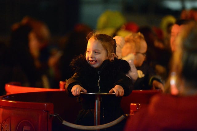 Big smiles from a young visitor enjoying one of the rides at the Christmas lights switch-on.