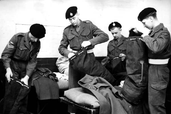 'I'm sure my mobile phone is in here somewhere...'FILE photo dated 24/10/52 of national service men of the 1st Royal Tank Regiment packing their kit at Fowler Barracks, Tidworth, in readiness for their departure for Korea. Teenagers would not be sent to jail for defying the Tories' proposed "mandatory" national service, James Cleverly has said, as Labour branded the policy a "gimmick". Photo credit: PA/PA Wire