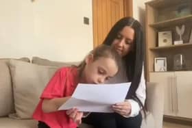 Chanel and Fay Murrish open the video by writing a message to be passed around 43 other heart families.