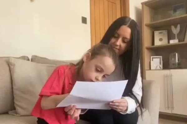 Chanel and Fay Murrish open the video by writing a message to be passed around 43 other heart families.