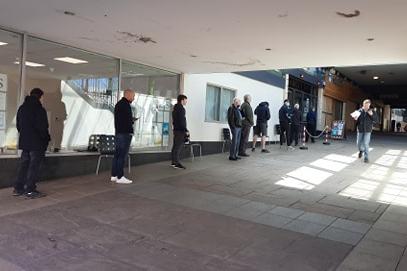 Queues outside the Haircut Inn in Lazarus Court.