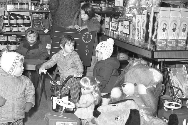 These awestruck children loved looking in the toy section of Woolworths in Washington in 1973.