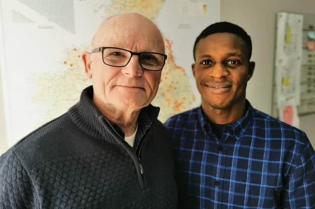 Samson Okoro, 30, with pastor Ken Devine, 70.