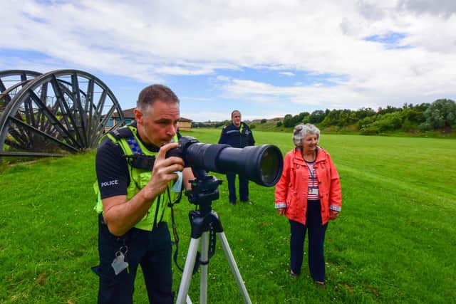 PC Colin Murison (left) with Sgt. Craig Sherriff and Councillor Elizabeth Gibson testing the new long lens camera.