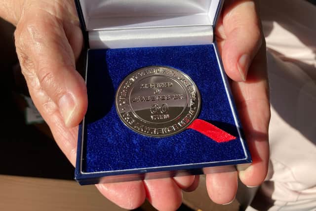 The 82-year-old South Shields woman was presented with the medal in recognition of her feat of having managed the condition successfully for 60 years.
