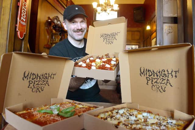 Dan Shannon with the four-square pizzas. Pizzas are made in the kitchen at Ship Isis and can be collected from the back door of the pub.