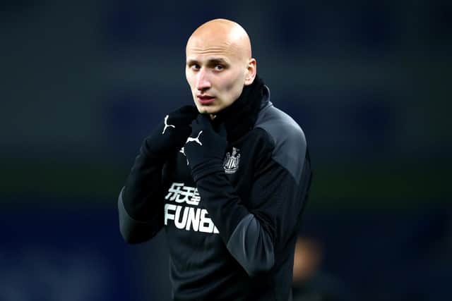 Jonjo Shelvey warms up at the Amex Stadium.