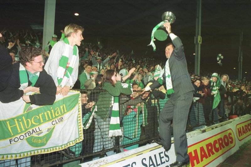 John Burridge shows off the Skol Cup trophy to the Hibs fans at Easter Road in October 1991
