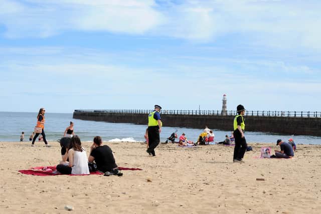 Sunderland City Council enforcement officer Marina Hallam and Natalie Moore, with  PCSO Graham Dinning and PC Martin Smith, at Roker Beach.
