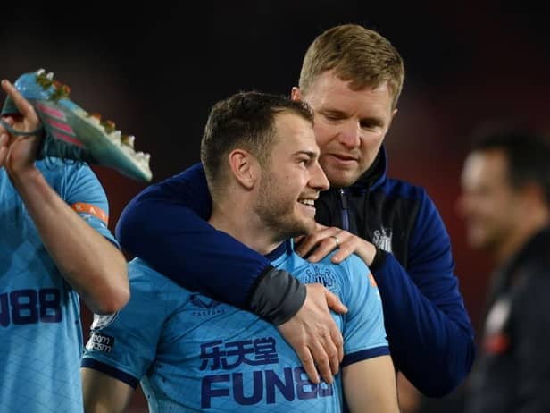 Ryan Fraser of Newcastle United is embraced by Eddie Howe, Head Coach of Newcastle United, after the final whistle of Premier League match between Southampton and Newcastle United at St Mary's Stadium on March 10, 2022 in Southampton, England.  (Photo by Mike Hewitt/Getty Images)