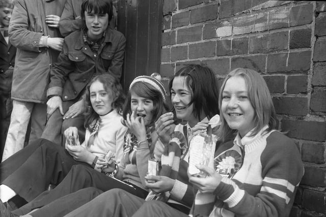 Four Shiney Row girls who grabbed a quick meal of crisps and nuts while waiting for the Fulwell End to open for the game against Luton.  The girls are (left to right) Anne Ainsley (14), Kathryn Steadham (14), Carol Rummney (15) and Angela Stephenson (15).