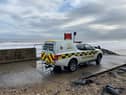 Coastguard searching for a woman swept away by tide at Hendon beach