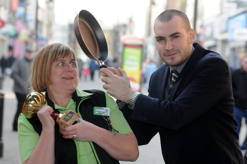 Asda's Mavis Maughan and Specsavers Scott Pinckney prepare for the annual pancake race in 2012.