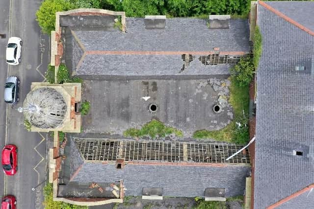 A drone shot showing damaged roof of the school building.