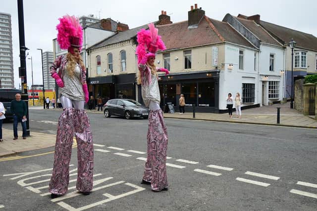 Stilt walkers entertain the crowds as the Empire Theatre re-opens after 18 months. Picture by FRANK REID.
