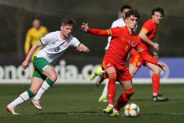 Niall Huggins of Wales U21 controls the ball watched by Mason O'Malley of the Republic of Ireland U21. (Photo by Clive Brunskill/Getty Images).