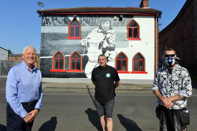 Artist Frank Styles with Jimmy Montgomery outside The Times Inn new Monty mural with landlord Steve Lawson.