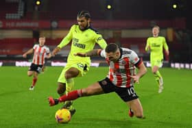 Newcastle United's US defender DeAndre Yedlin (L) vies with Sheffield United's English striker Billy Sharp during the English Premier League football match between Sheffield United and Newcastle United at Bramall Lane in Sheffield, northern England on January 12, 2021.