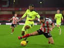 Newcastle United's US defender DeAndre Yedlin (L) vies with Sheffield United's English striker Billy Sharp during the English Premier League football match between Sheffield United and Newcastle United at Bramall Lane in Sheffield, northern England on January 12, 2021.